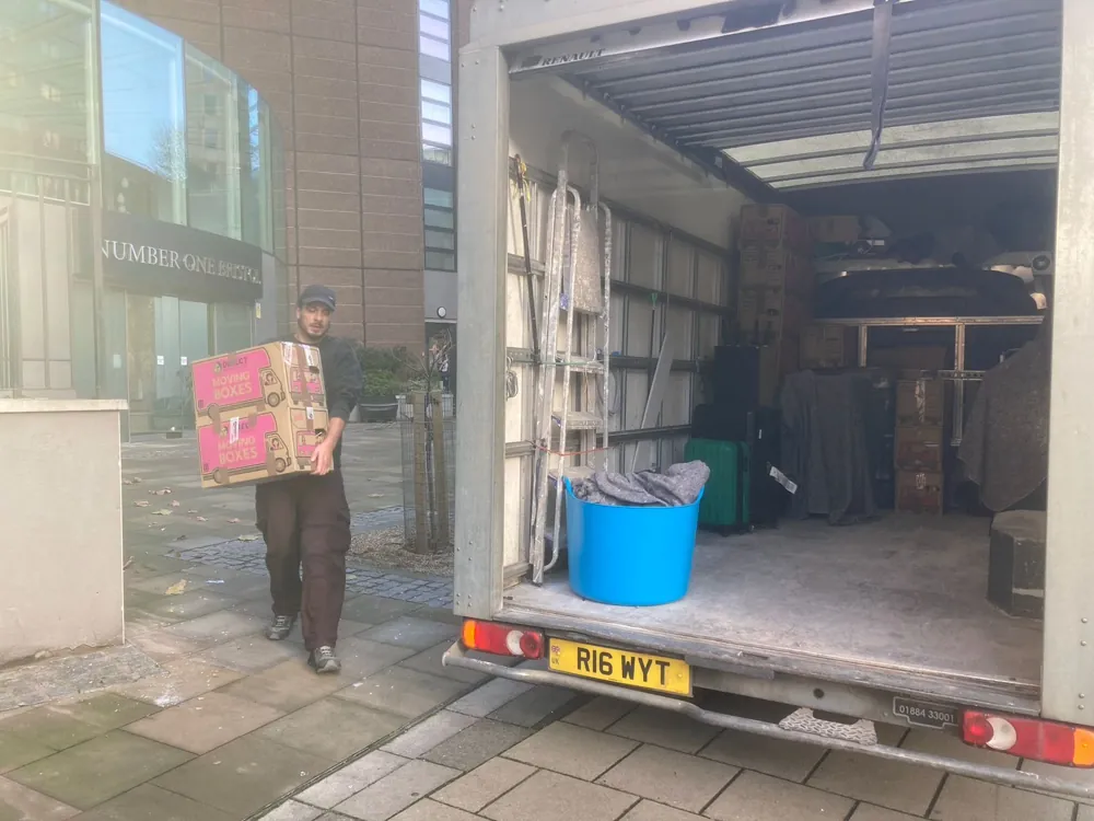 Carrying a box to a Luton van