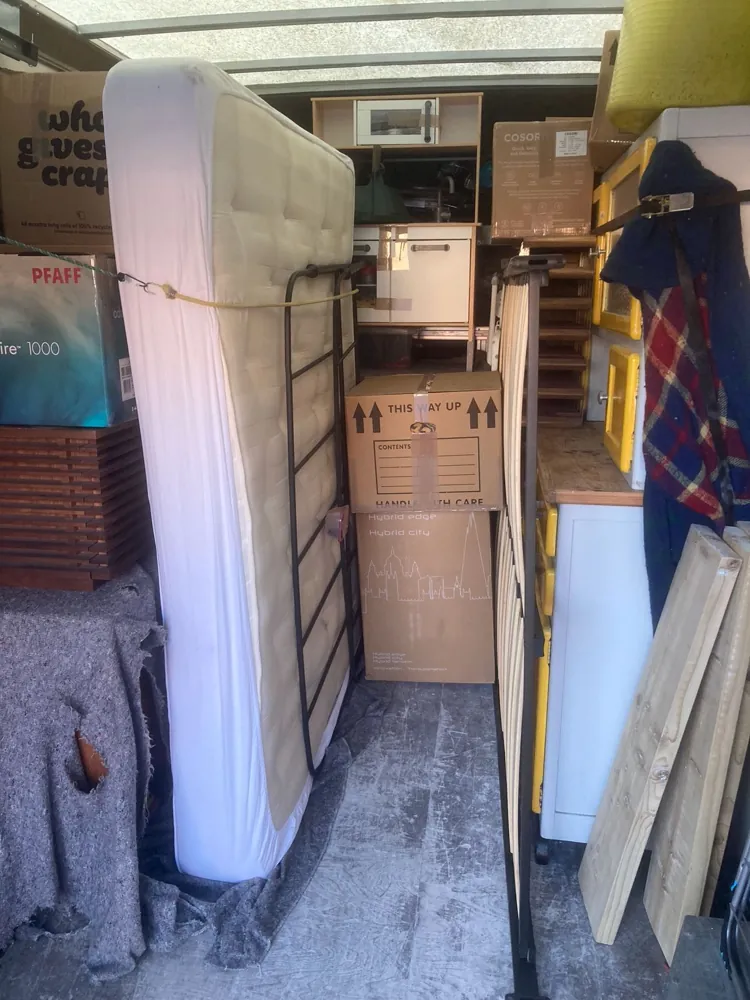 A Luton van loaded with a mattress and furniture