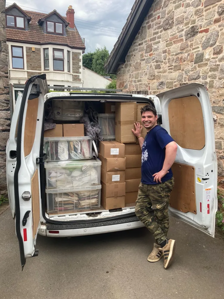 A van packed to the roof with boxes