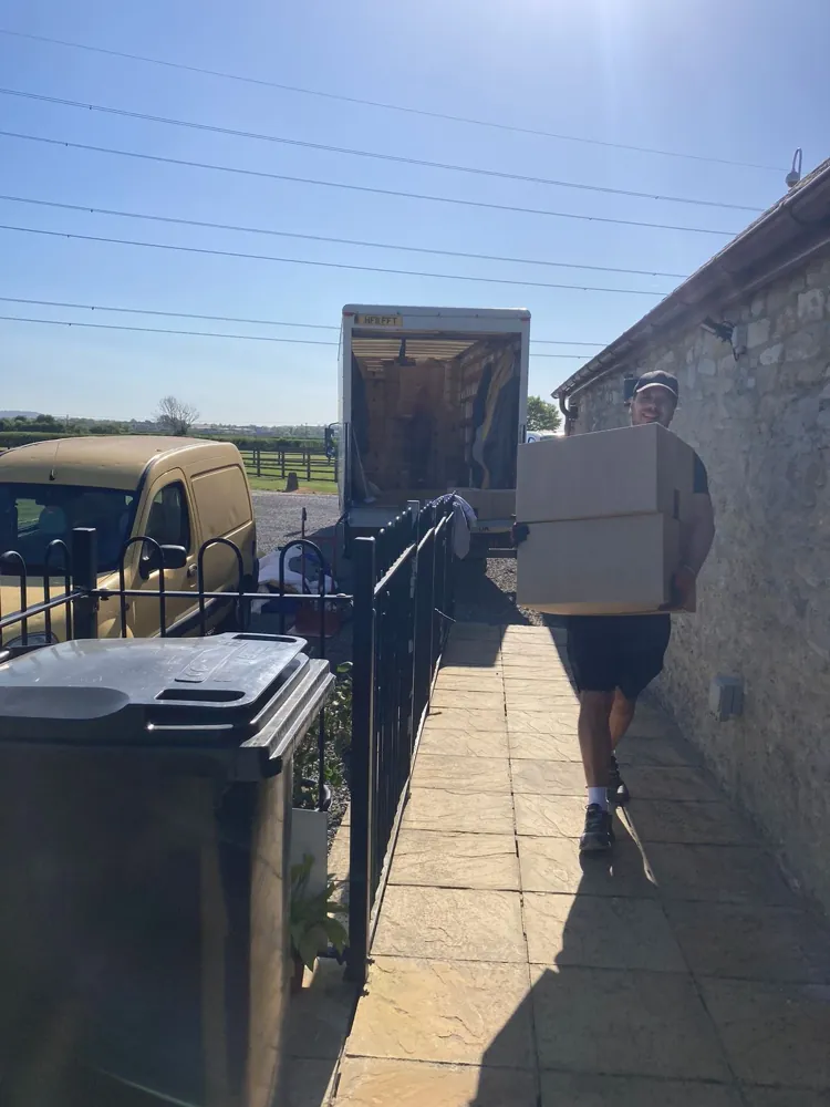 Carrying boxes to the van on a sunny move